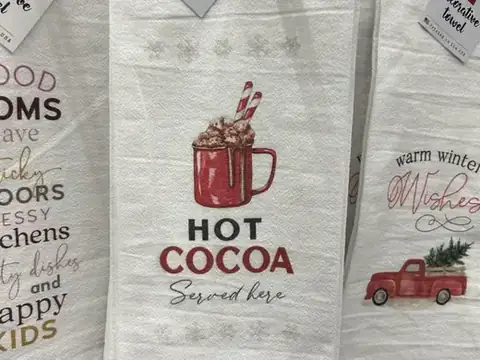Seasonal kitchen towels, including a Hot Cocoa design, in Charlestown
